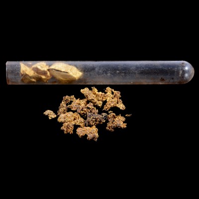 Lot 148 - Nuggets of crystal and yellow metal testing a gold.