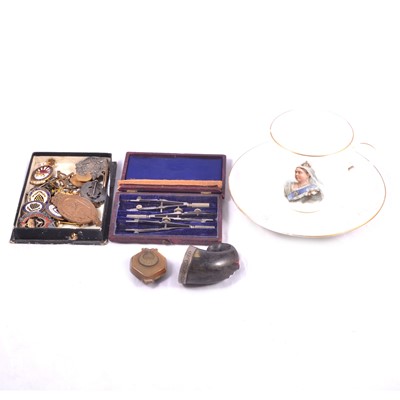 Lot 251 - A horn snuff mull, badges, Victorian cup and saucer.